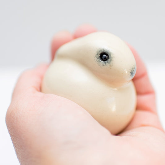 Ceramic Mountain Hare Sculpture held in a hand