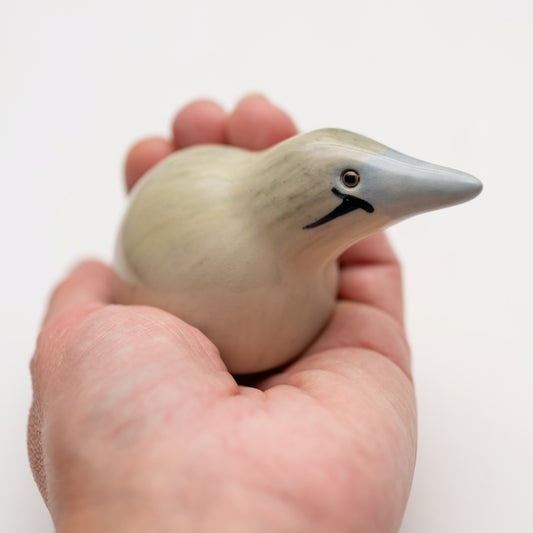 Small Ceramic Bittern Sculpture held in a hand