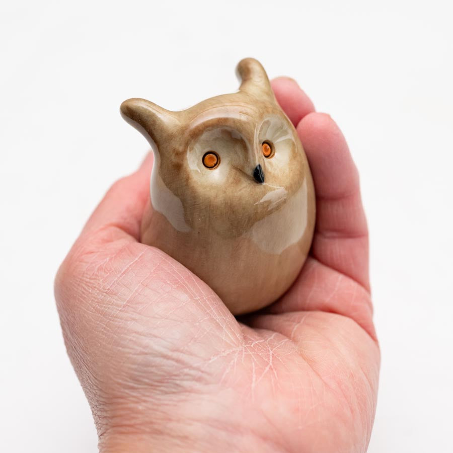 Small Ceramic Long Eared Owl Sculpture held in a person's hand