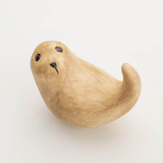 Natural finish Curly Otter, a light brown wooden otter figurine with black eyes and nose