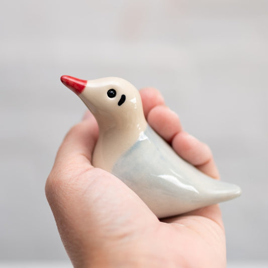 Small Ceramic Black Headed Gull Sculpture held in a hand