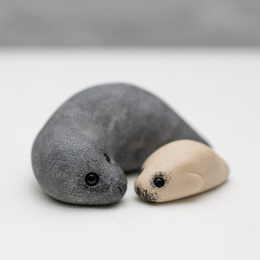 Ceramic Seal Gift Set featuring a large grey seal and a small beige seal