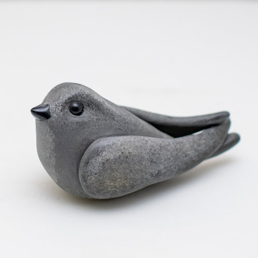 Ceramic Swift Sculpture, dark grey with black beak and eyes, on a white background