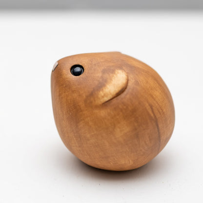 Brown Ceramic Vole sculpture on a white backgroud