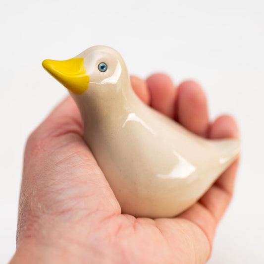 Small Ceramic Blue Eyed Duck Sculpture held in a hand