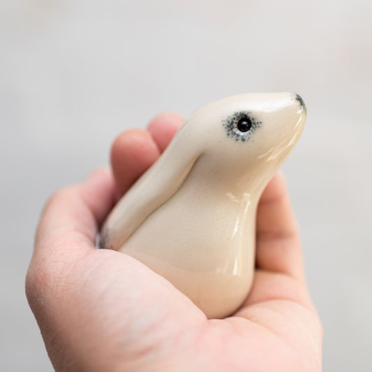 Kissing Mountain Hares Sculpture, close up of one hare held in a hand