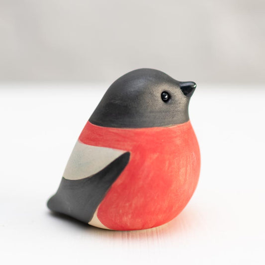 Small Ceramic Bullfinch Sculpture with black head, red breast, and white wing markings