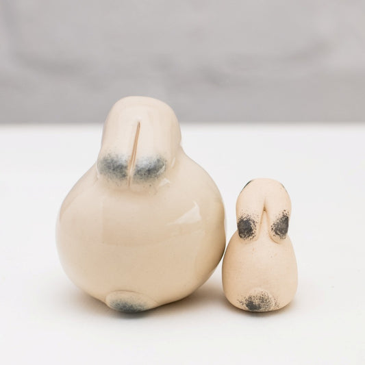 Ceramic Mountain Hare Gift Set, two ceramic hares, one large and one small, with black ears and tails