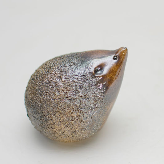 Small ceramic hedgehog with a shiny metallic brown glaze