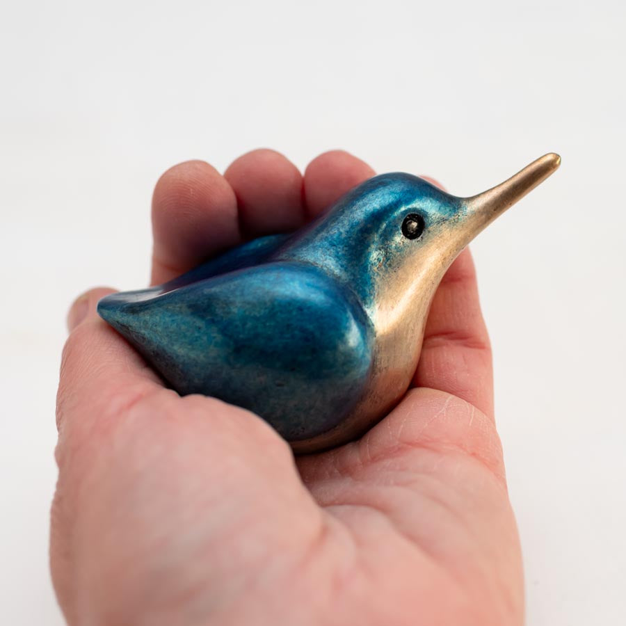 Small Bronze Kingfisher Sculpture held in a person's palm, blue and bronze with a long beak