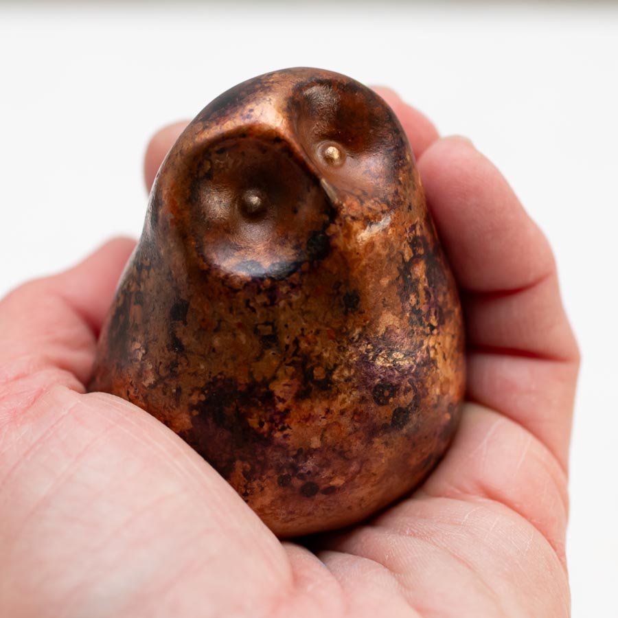Small Foundry Cast Bronze Owl Sculpture, copper and purple, held in a hand