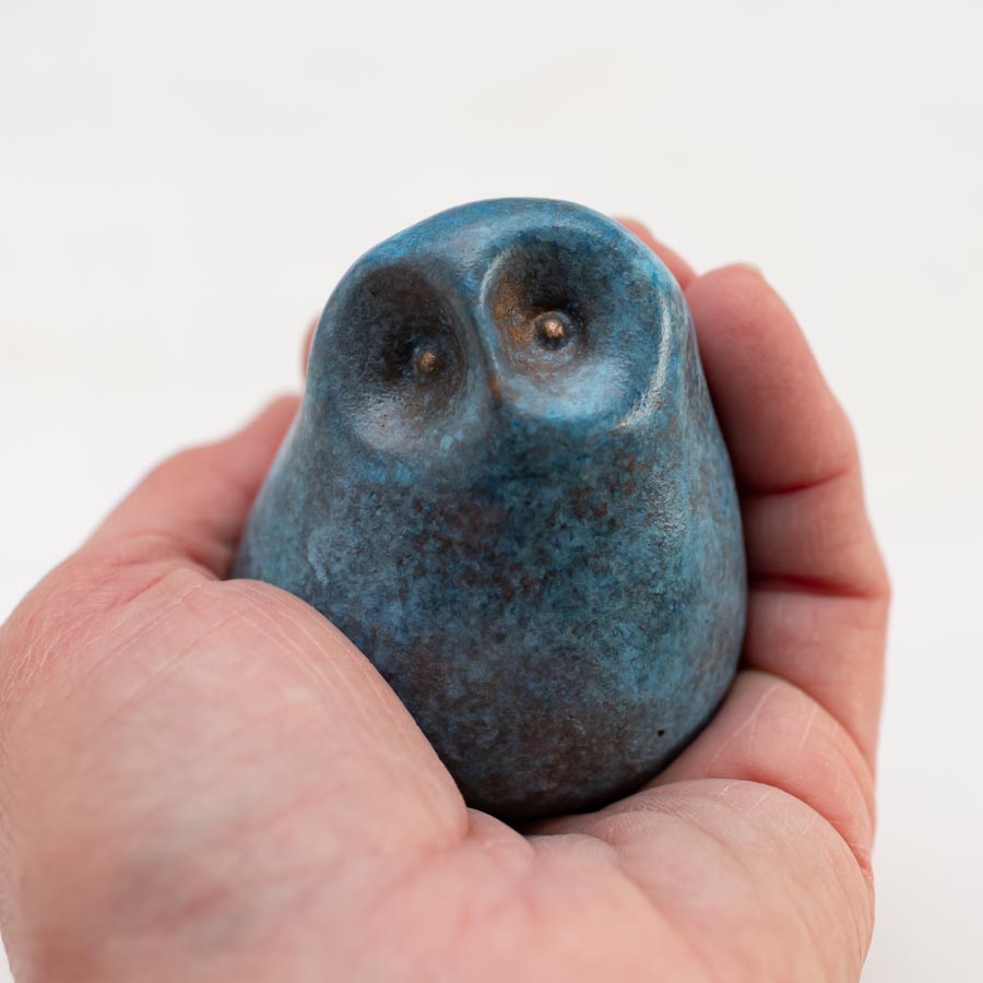 Small Foundry Cast Bronze Owl Sculpture in light blue held in a hand