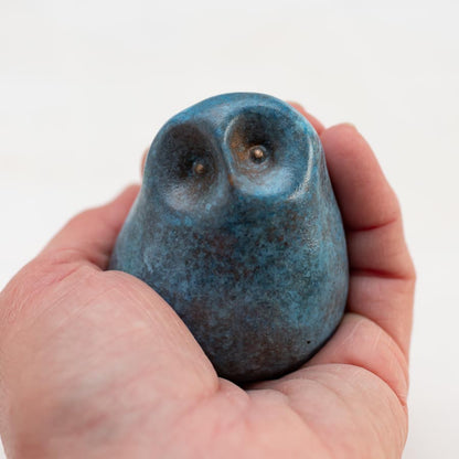 Small Foundry Cast Bronze Owl Sculpture in light blue held in a hand
