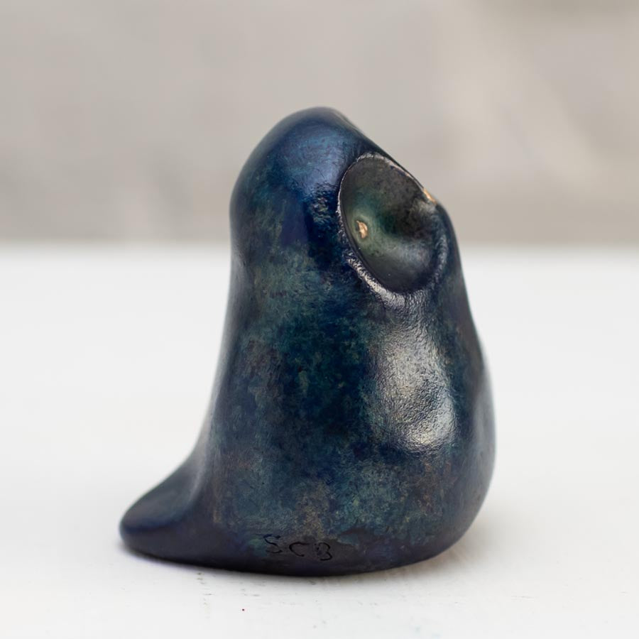 Small Foundry Cast Bronze Owl Sculpture in Midnight Blue, with a textured finish and a single eye