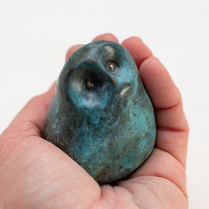 Small Foundry Cast Bronze Owl Sculpture in minty green held in a hand