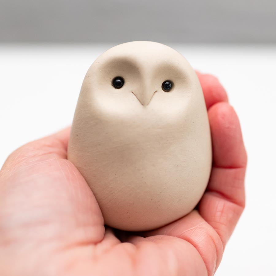 Small white ceramic owl